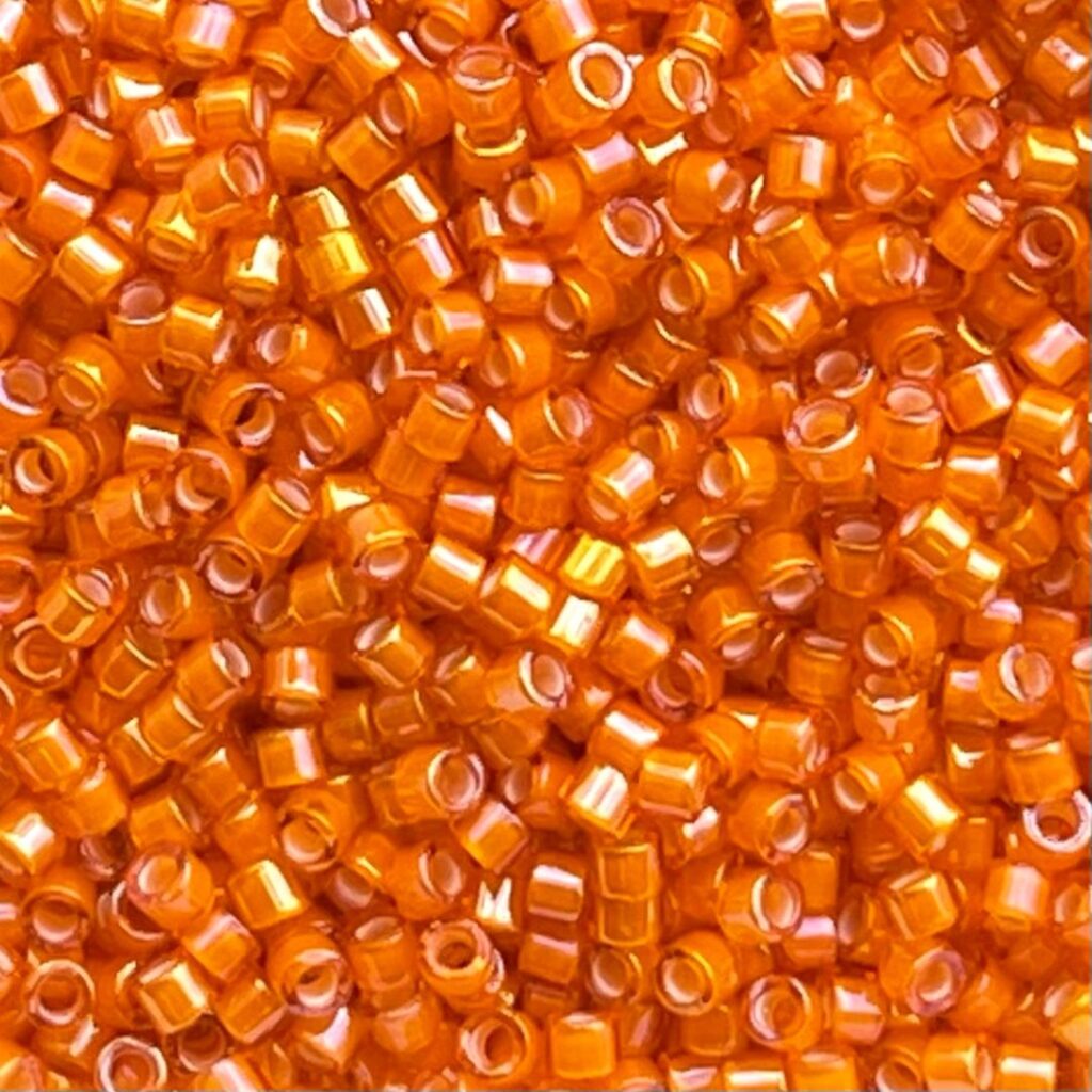 Delica Bead White Lined Orange AB