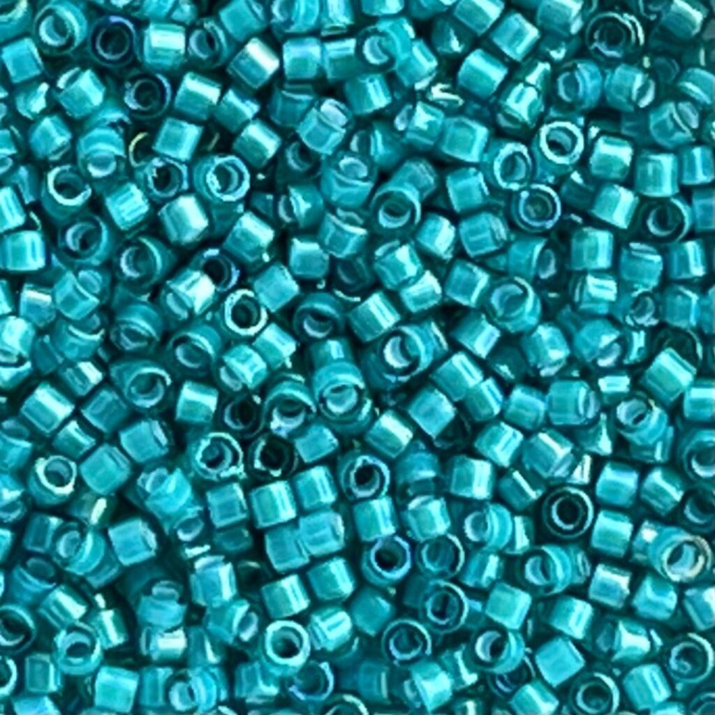 Delica Bead White Lined Teal AB