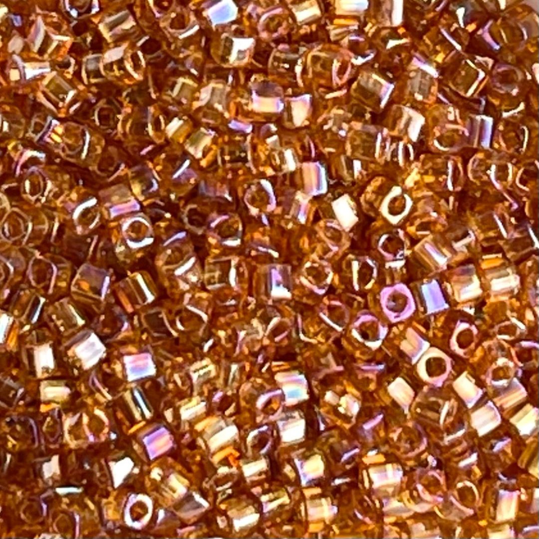 Toho Cube 1,5mm Transparent Rainbow Topaz - Image 1
